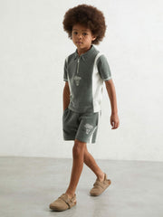 9-13 yrs Chenille Tipped Motor Cars Polo Shirt Dark Sage Green/White | Children